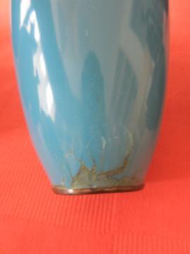 and smaller fish decorated vase