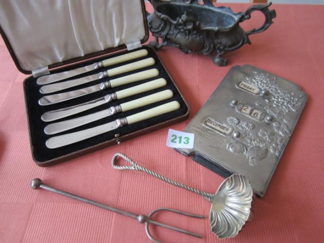 metal (possibly pewter) calendar on stand