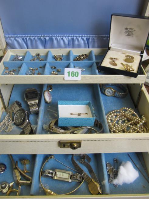 cream jewellery box containing assorted
