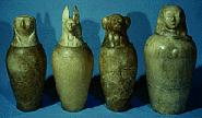 Here are some jars with lids depicting the four sons of Horus: - Qebehsenuef: the falcon head for the intestines - Duamutef: the jackal head for the stomach.