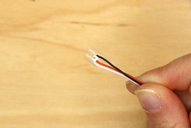 Repeat to attach each NeoPixel to its nail. When the glue has dried, it's a good idea to coat each nail with epoxy for added security and strain relief.