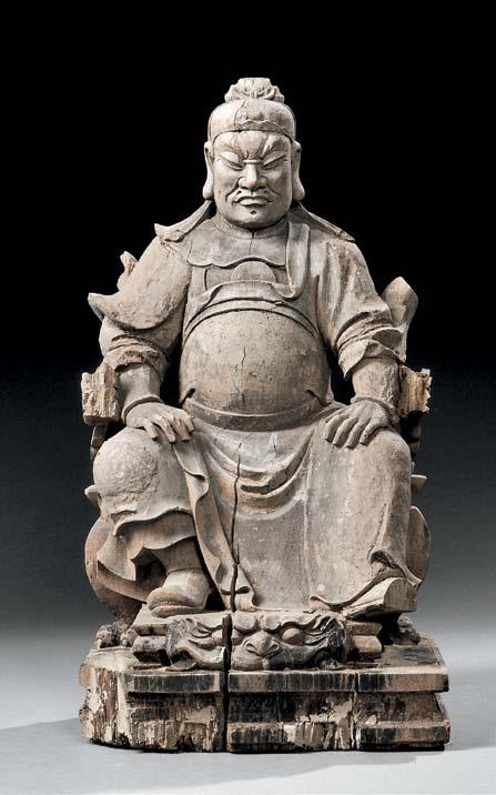 58 59 58 Wood Carving of an Official, China, late Ming dynasty, seated in a dragon-inspired chair with four paw-shaped legs, dressed in an official s