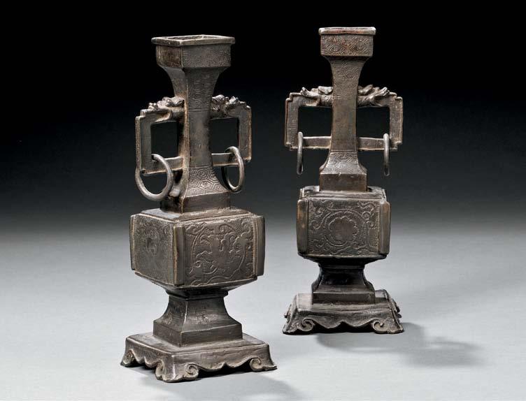 63 64 63 Pair of Bronze Altar Vases, China, Qing dynasty, square gu form with squared dragonhead handles and hanging rings, the sides of the vases impressed with floral motifs and a