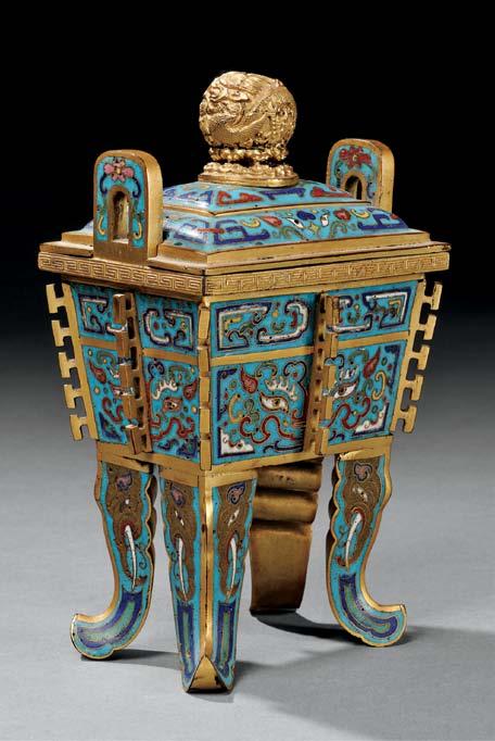 77 77 Cloisonné Covered Censer, China, 19th century, fangding-shape with two high loop handles, decorated with taotie designs to body divided by eight vertical flanges, the feet outwardly curved,