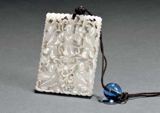 $700-900 83 Rectangular Openwork Jade Pendant, China, 19th/20th century, carved with a woman and four children holding lotus branches and lingzhi mushrooms in two tiers, on a ground with openwork