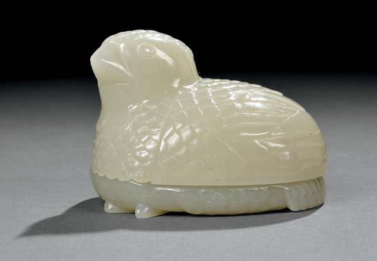 $2,000-3,000 89 Jade Covered Box, China, 19th/20th century, the evenly colored pale celadon jade carved in the form of a recumbent quail with