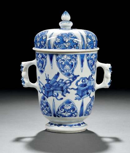 underglaze blue on two raised reserves, the reticulated ground with bats and clouds between a pendant ruyi lappet and an upright leaf lappet, all molded with a subtle anhua design, the neck and mouth