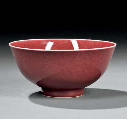 118 119 118 Red-glazed Porcelain Bowl, China, Qing dynasty, with flared sides and slightly everted rim, resting on a straight foot, both interior and exterior glazed in red except around the rim, the