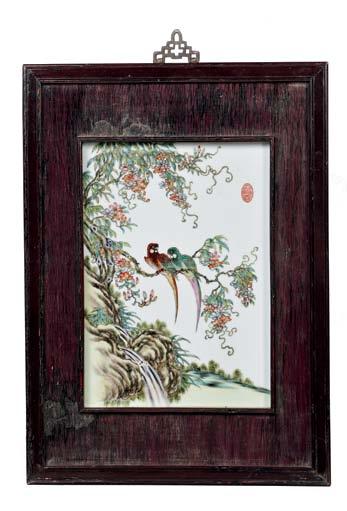 133 Enameled Porcelain Plaque, China, 20th century, depicting a pair of peacocks with peonies and pine trees in polychrome enamels on a white-glazed ground,
