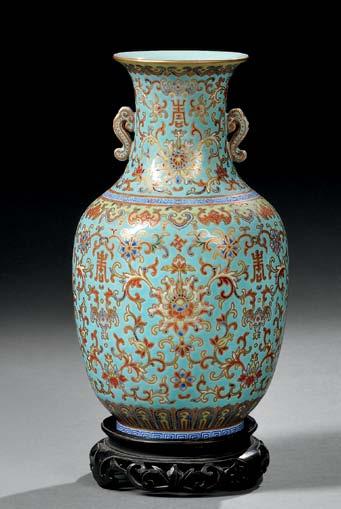 134 135 134 Gilt and Enameled Vase, China, 19th century, oviform with waisted neck flaring to mouth, resting on a raised straight foot, the body decorated with lotus scrolls, bats, swastikas, and