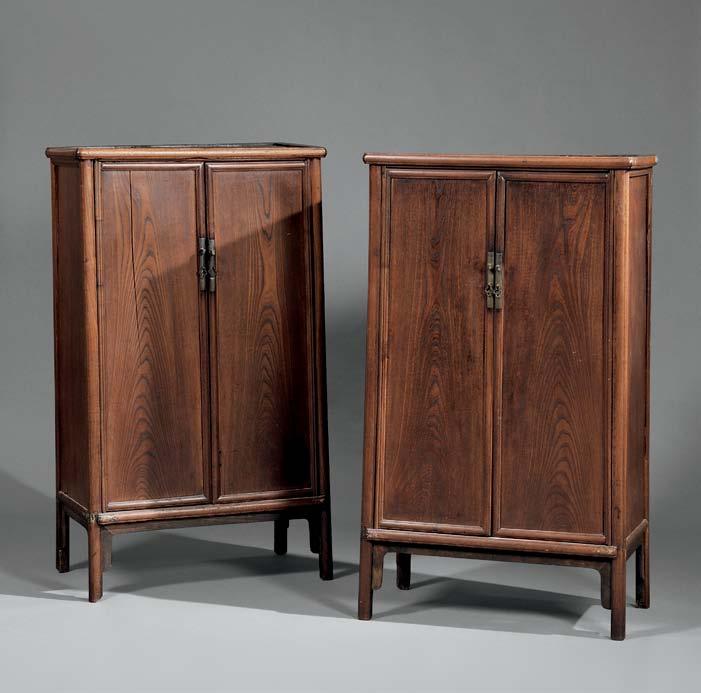168 168 Pair of Tapered Elmwood Cabinets, China, 19th century, splayed corner posts of curved section enclosing single-panel doors, interior fitted with three shelves, the