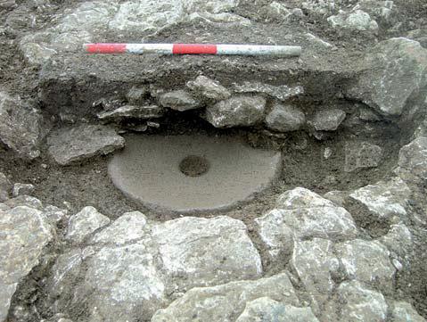 Cirencester before Corinium roughly in a ring 10 m in diameter (Fig. 22C). They were of similar size, averaging 0.16 m in depth and 0.65 m across their widest extents.