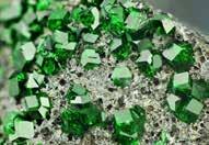 The green is caused by traces of chromium or vanadium and is often mistaken for Emerld, who s colour is also from traces of these same elements.