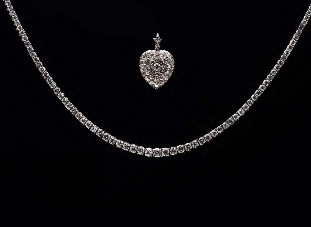 0. This beautiful diamond encrusted heart locket pendant is an example of fine Victorian craftsmanship.