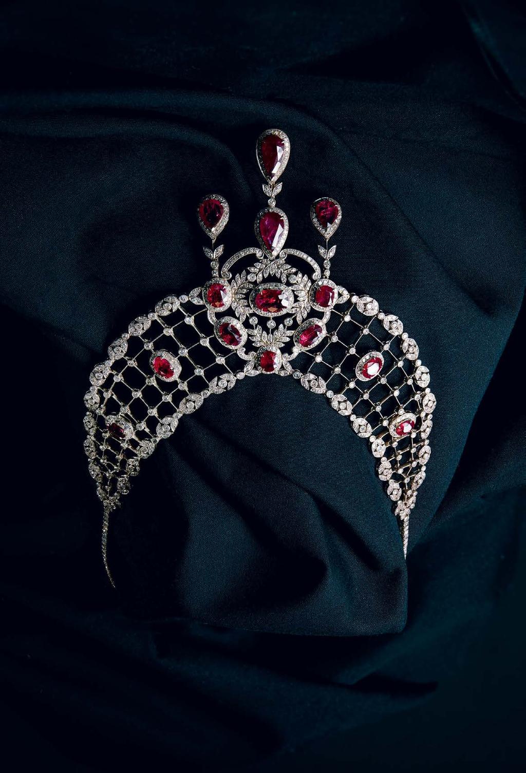 Select Jewellery & Watches 11 25 A 19th century ruby and diamond set necklace composed of a single row of small round cut diamonds, suspending a tapering trellis work section set throughout with