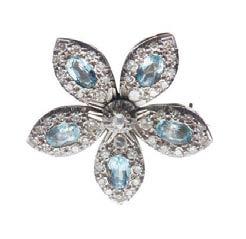 24 Lyon & Turnbull 67 HC473/2 An aquamarine and diamond set floral brooch set with five oval cut aquamarines to each petal, and pavé set throughout with small round eight cut diamonds, set in 18ct