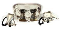 30-50 193 A silver cream jug, by Mappin & Webb, of panelled form having C scroll handle, Birmingham 1914 30-60 194 Two small silver swing handled bon bon baskets, London 1912; a silver mustard,