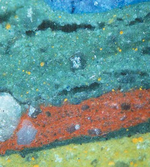 Photomicrograph by Lore Kiefert; magnified 50. within a given band. In places, rounded droplets with the same granular texture as the surrounding bands, but of a different color, were present. The S.