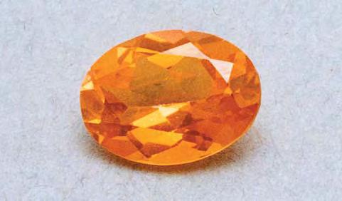 Figure 33. The orange color of this 2.95 ct topaz is caused by a thin coating of synthetic hematite applied to the pavilion. Photo by Michael S. Krzemnicki; SSEF Swiss Gemmological Institute.