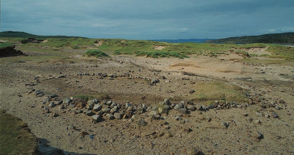 Coastal erosion is a huge problem in Scotland, not just by the sea but also by the wind. Here the rubble footings of an oblong house have been exposed as the wind has blown away the sand dunes.