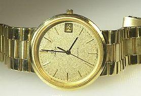 166052 168033, men's wristwatch, 18K gold, self-winding, plastic crystal, date, leatherstrap, ca 1969.