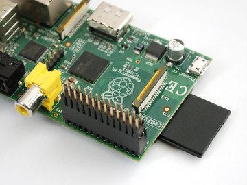Place the big 2x13 pin header onto the Raspberry Pi GPIO breakouts so that it covers