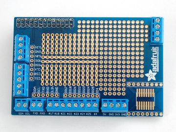 Place the blue terminal blocks around the perimeter of the Proto Plate PCB.