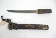 Wakizashi, late 19th century Bronze, red and black lacquer, seed pearls, brown silk braid 29 1/2 x 1 1/2 inches Gift of Mrs.