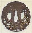 94. Tsuba (Sword Guard), early 19th century Kikaku Iron, brass, copper, silver, and gold 3 1/8 x 2 7/8 inches Gift of Ralph D. Cutler in the name of Mrs. Ralph W. Cutler, 1921.99 95.
