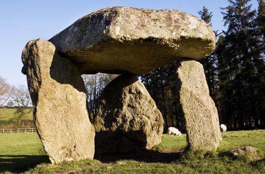 Fig. 2. Spinsters Rock chamber tomb in Devon, surviving as a free standing dolmen. Fig. 3. Lanyon Quoit, Madron, Cornwall. Note the two portal stones set at right angles to the axis of the chamber.