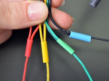 At the ends of these extension wires, solder four header pin prototyping wires,