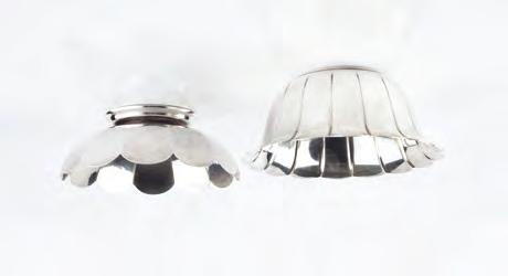537. AN AMERICAN STERLING BOWL by Tiffany & Co, of lobed design, No. 23991, 14.5cm diameter; and another similar bowl on pedestal foot by Shreve, Crump & Low, 15cm diameter (2) 538.