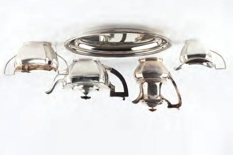 546. A SILVER THREE PIECE TEA SERVICE, of shaped outline, the teapot with ebonised handle and knop by J.B.