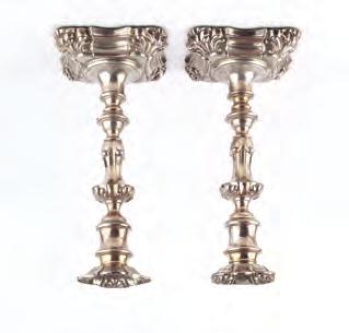 A PAIR OF WILLIAM IV SILVER CANDLESTICKS, with knopped stems on shaped square section bases with fleur de lys corners by William Allanson & Co, Sheffield 1833, 23cm