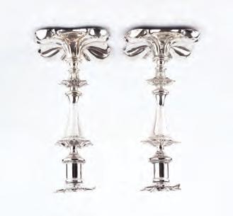 598. A PAIR OF 19TH CENTURY SILVER PLATED CANDLESTICKS, the knopped stems with petal form decoration, on shaped square bases, 23cm high (2) 30-50 (plus 24% BP*) 599.