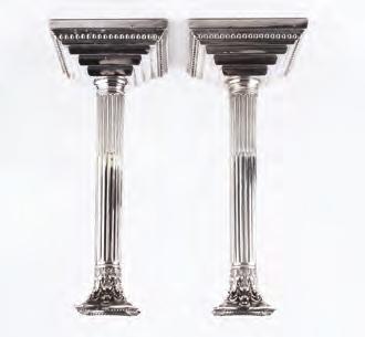 622. A PAIR OF SILVER CANDLESTICKS, of corinthian column form, on stepped and beaded square bases by William Hutton &