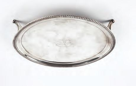 A GEORGE III SILVER CIRCULAR SALVER, with gadrooned border, on shaped scroll feet by Peter & William Bateman, London 1809, 23.5cm, 13 oz 120-180 (plus 24% BP*) 662.