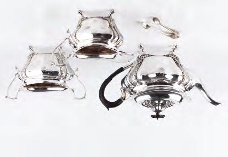 A SET OF EIGHT SILVER SCALLOP FORM MENU HOLDERS, each on circular base, by Israel Freeman & Son Ltd, London 1973, 2cm high; a silver three piece cruet set, comprising a mustard and a pair of peppers,