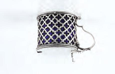723. A GEORGE III SILVER DRUM MUSTARD, pierce decorated with a repeated Gothic quatrefoil design and with beaded borders, blue glass liner, maker I.B., London 1801, 7.5cm high 724.