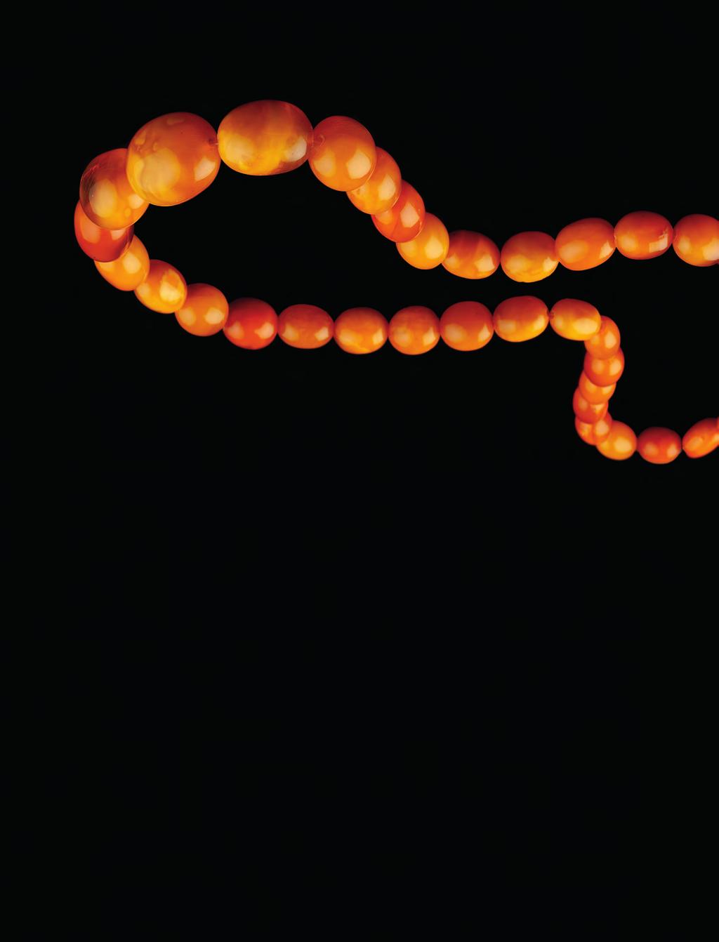 240. AN AMBER BEAD NECKLACE, comprising a continuous single strand of graduated amber beads, measuring approximately 15mm to 30mm in length, (amber untested for origin and treatments), length