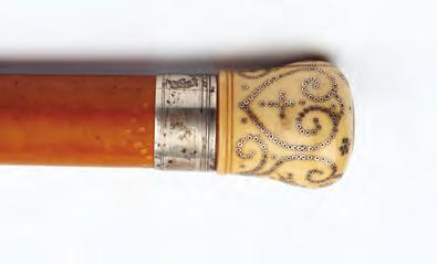384. AN EARLY 18TH CENTURY IVORY AND SILVER PIQUÉ WORK HANDLED WALKING CANE, with malacca shaft, the ivory handle