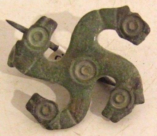 F. Coimbra: Symbols for protection in war among European societies Figure 10. Fibula with four horses heads. (Photo: D. Delfino).