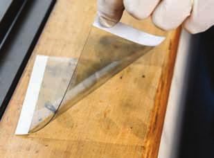 If they find a fingerprint, police cover it with a transparent (see-through) sticky sheet.