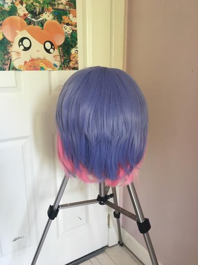 This piece is glued on top of the head and will become the front bangs of the wig.