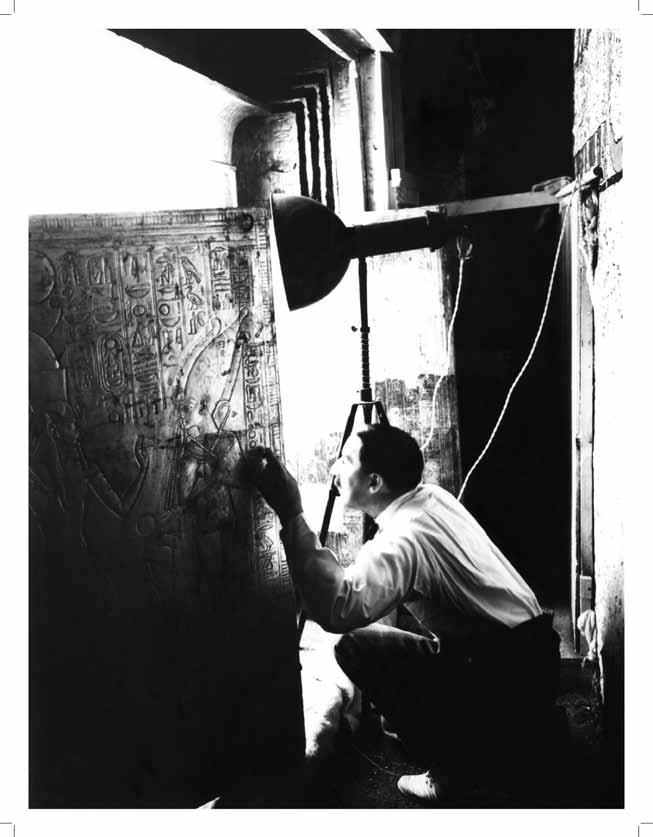 Howard Carter opening the door of the 2 nd shrine Tutankhamun s sarcophagus was protected by a set of four massive shrines constructed of wood and covered with gesso overlaid with thin sheet gold.