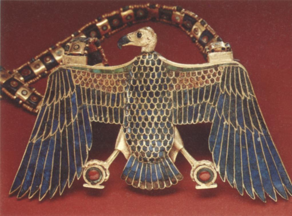 This flexible gold collar, fragile and purely funerary, is inlaid with "feathers" of colored glass in imitation of turquoise, jasper, and lapis lazuli.