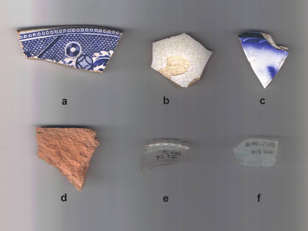 Plate 9: Selected Stage 2 Artifacts from Gourley Site (BhFx-39) a, blue transfer platter rim, BhFx-39-10, N5E72 b, refined white earthenware vessel side, BhFx-39-9, N5E9 c, flow blue plate rim,
