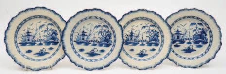 439 440 441 442 439 Four Liverpool pearlware plates of circular form with moulded overlapping shell edge painted in blue with an Oriental landscape with candy stripe