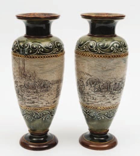 454 A pair of Royal Doulton stoneware vases by Hannah Barlow each of footed oviform with raised neck, incised with a broad continuous band of grazing sheep and a sheep dog beside a wood, flanked by