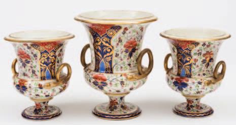400-500 471 A garniture of three Derby vases of campana form with gilt serpent handles, painted in imari colours with panels of stylised flowers and